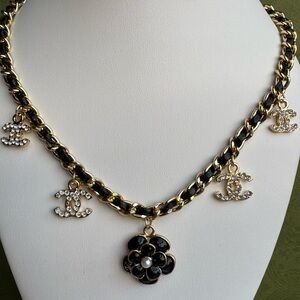 Chic Black and Gold Necklace with Iconic Charms